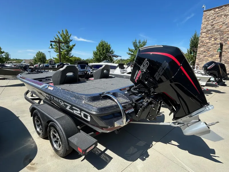 Slide: The Image of 2025 Nitro Z20 XL Pro boat with powerful engine, parked outdoors on a sunny day. - 5