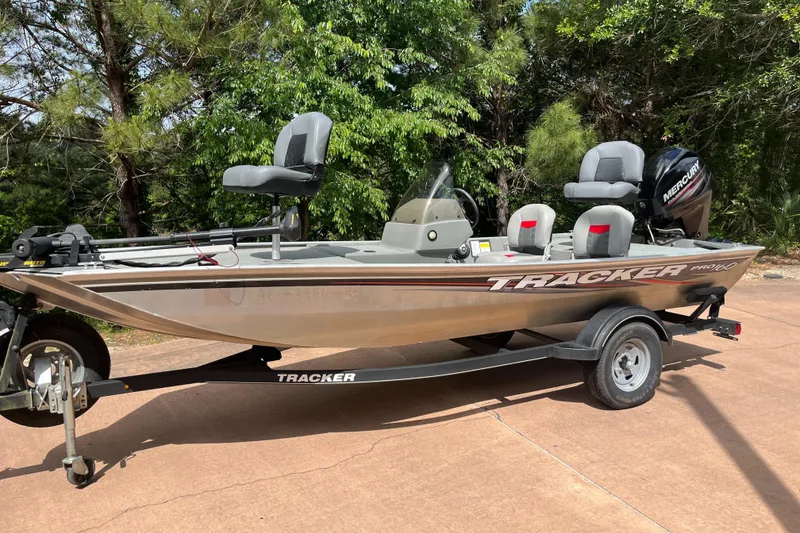 Slide: The Image of 2017 Tracker PRO160 fishing boat on trailer, parked outdoors. - 3