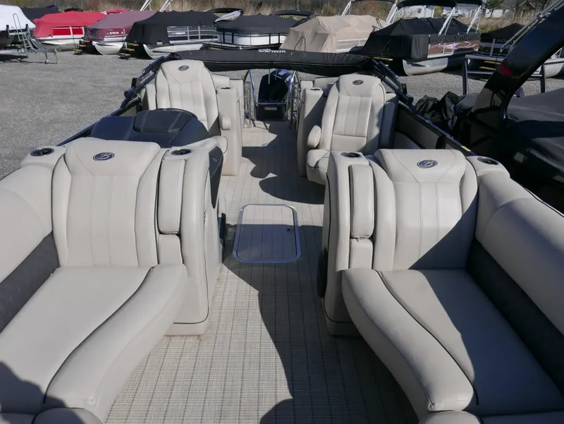 Slide: The Image of 2019 Barletta L23QCSS pontoon boat interior with luxurious seating and spacious layout. - 10