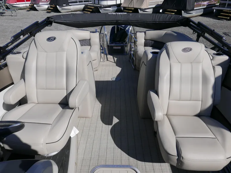 Slide: The Image of 2019 Barletta L23QCSS boat interior with beige seating and spacious layout. - 14