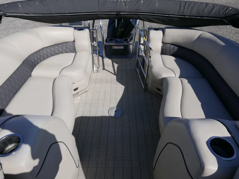 Slide: The Image of 2019 Barletta L23QCSS pontoon boat interior with plush seating and cup holders. - 17