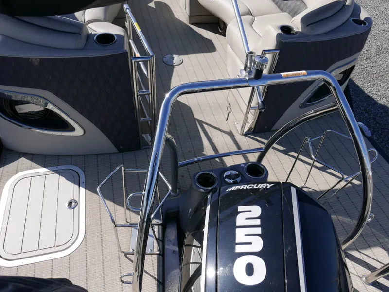Slide: The Image of 2019 Barletta L23QCSS pontoon boat with Mercury 250 engine, featuring spacious seating and sleek design. - 19