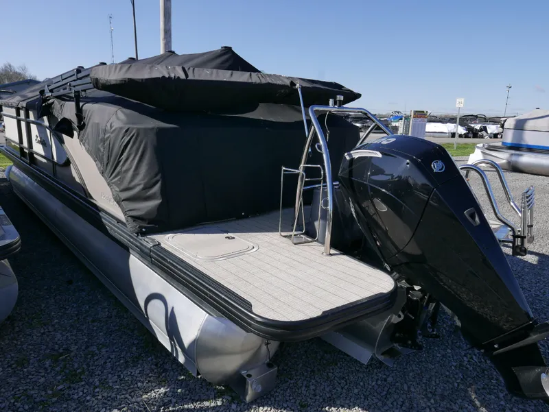 Slide: The Image of 2019 Barletta L23QCSS pontoon boat with covered seating and powerful outboard motor. - 4