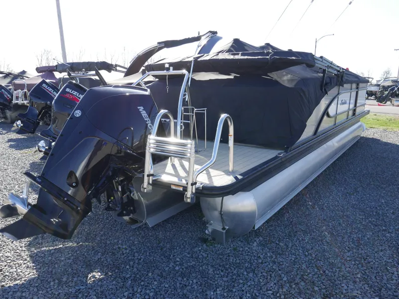 Slide: The Image of 2019 Barletta L23QCSS pontoon boat with covered deck and outboard motor. - 5