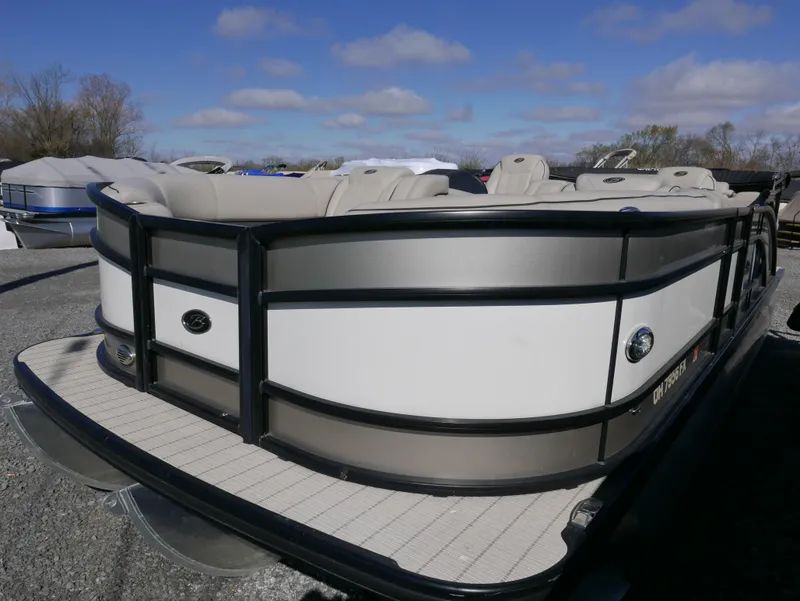 Slide: The Image of 2019 Barletta L23QCSS pontoon boat with sleek design, docked outdoors. - 7
