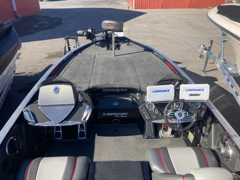 Slide: The Image of 2015 Ranger Z521 Comanche boat interior with dual Lowrance displays and Mercury Pro Team branding. - 11