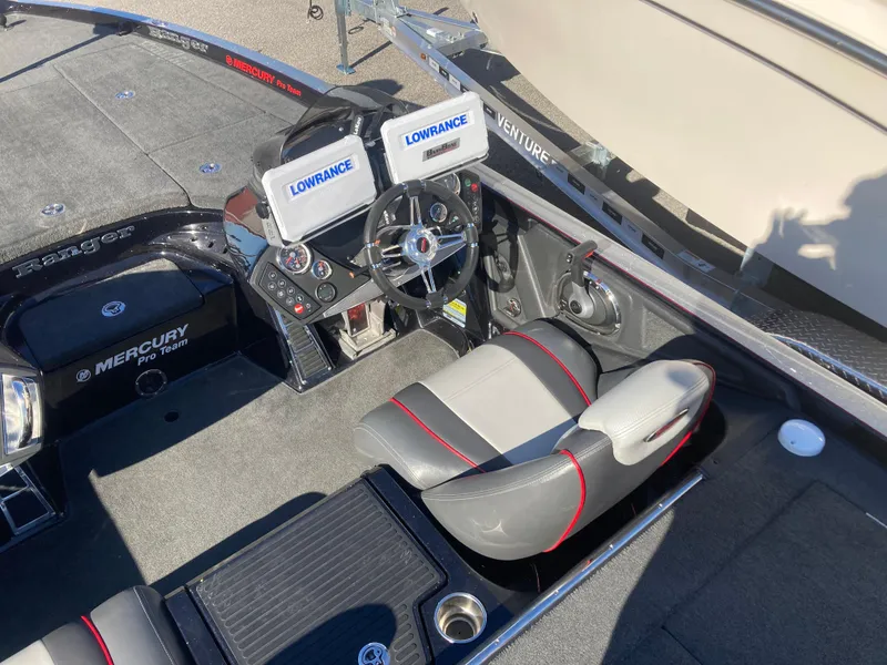 Slide: The Image of 2015 Ranger Z521 Comanche boat interior with dual Lowrance displays and Mercury Pro Team engine. - 13