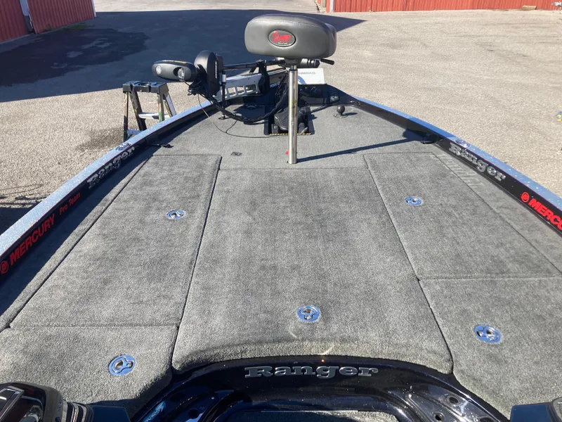 Slide: The Image of 2015 Ranger Z521 Comanche boat deck with seating and storage compartments. - 14