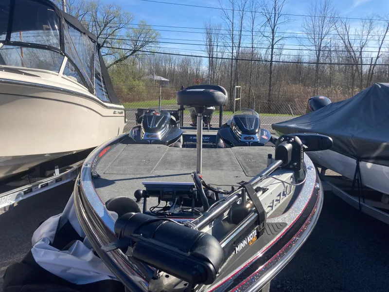 Slide: The Image of 2015 Ranger Z521 Comanche boat with trolling motor, parked outdoors. - 25
