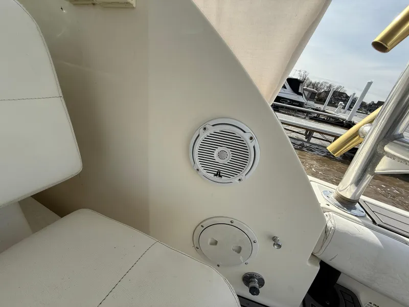Slide: The Image of 1998 Tiara Yachts 2900 Open interior with speaker and seating detail. - 10