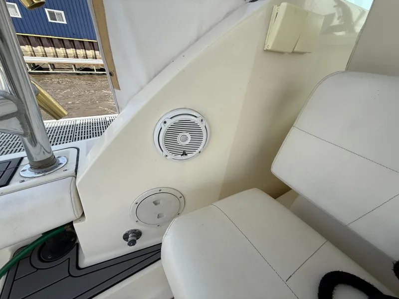 Slide: The Image of 1998 Tiara Yachts 2900 Open interior with speaker and seating detail. - 11