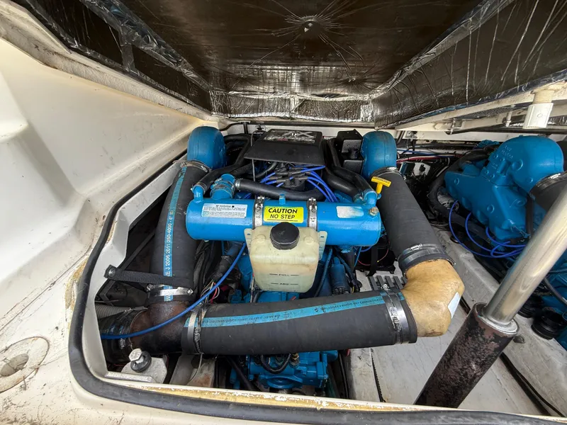 Slide: The Image of Engine compartment of a 1998 Tiara Yachts 2900 Open, showcasing marine engine components. - 15