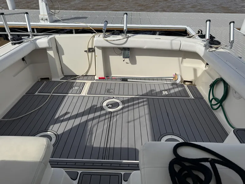 Slide: The Image of 1998 Tiara Yachts 2900 Open boat deck with seating and storage compartments. - 26