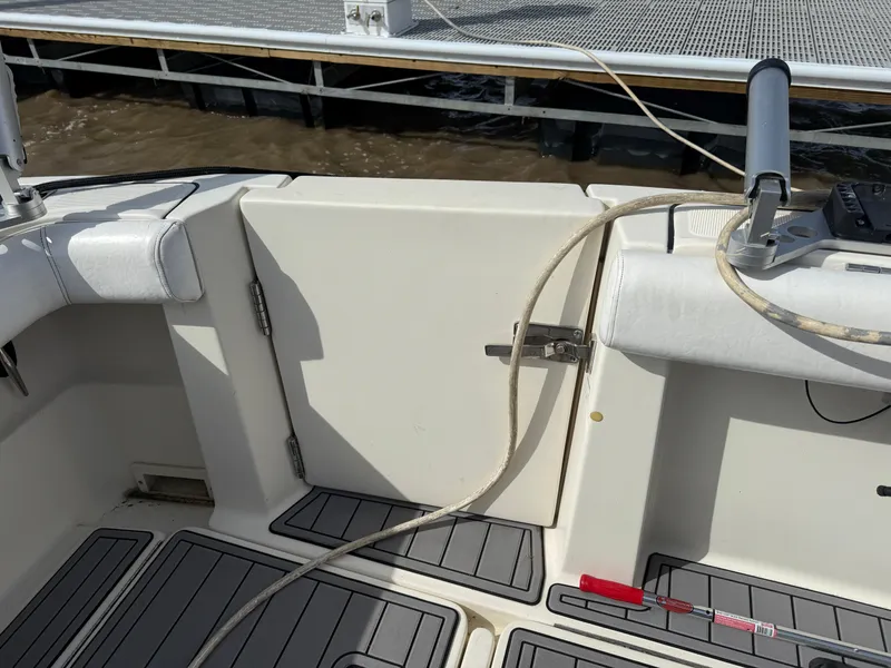 Slide: The Image of 1998 Tiara Yachts 2900 Open boat deck with dock in background. - 27
