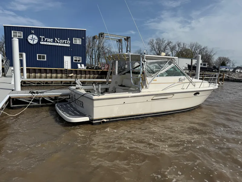 Slide: The Image of 1998 Tiara Yachts 2900 Open docked near True North building. - 3