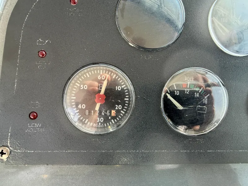 Slide: The Image of Dashboard gauges of a 1998 Tiara Yachts 2900 Open boat. - 6