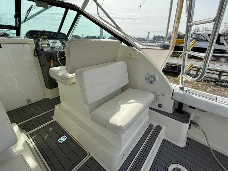 Slide: The Image of 1998 Tiara Yachts 2900 Open interior with helm and seating area. - 8
