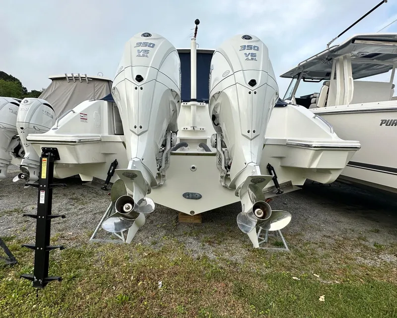 Slide: The Image of 2025 Pursuit DC 326 Dual Console boat with twin 350 V8 engines, rear view. - 17