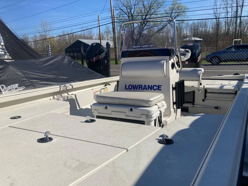 Slide: The Image of 2023 Ranger RB200 boat with Lowrance equipment, featuring a spacious deck and comfortable seating. - 2