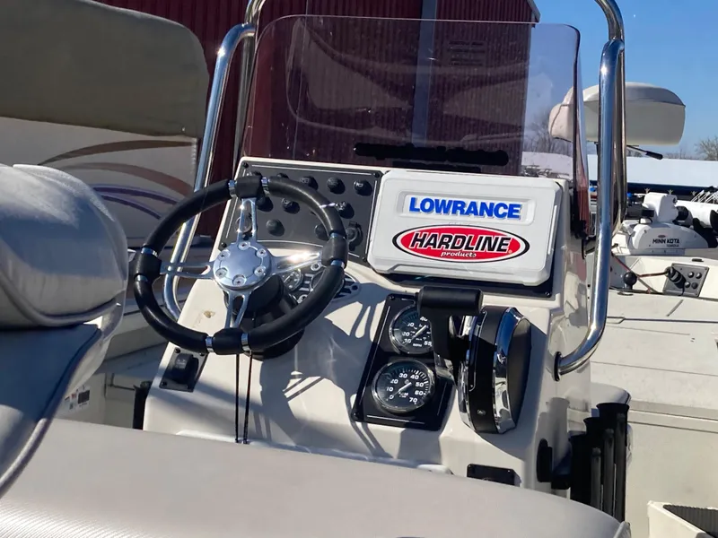 Slide: The Image of 2023 Ranger RB200 boat dashboard with steering wheel and navigation instruments. - 7