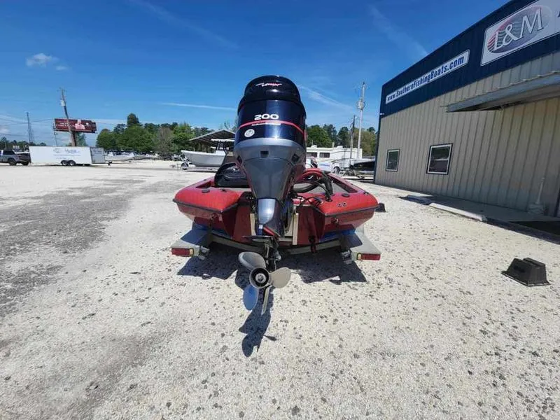 Slide: The Image of 2007 Blazer 190 Pro-V boat with powerful outboard motor in a parking lot. - 4