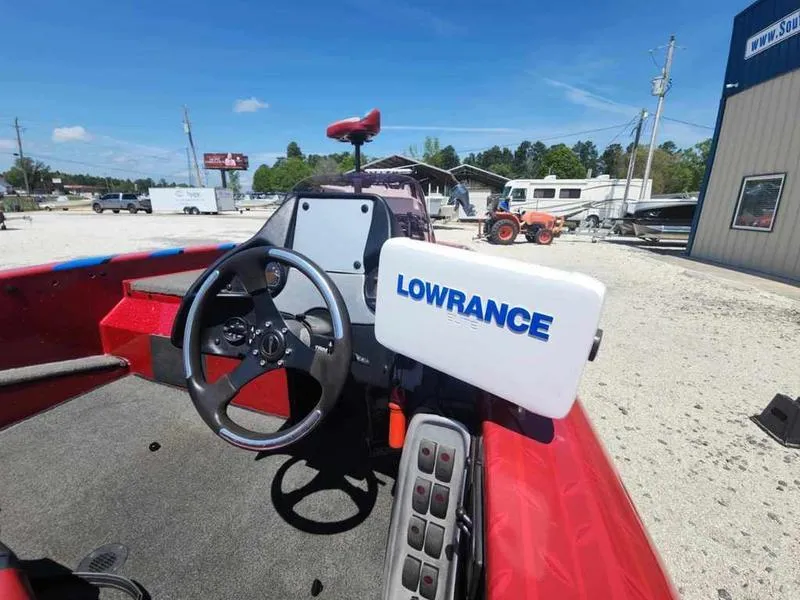 Slide: The Image of 2007 Blazer 190 Pro-V boat interior with Lowrance navigation system, red seating, and steering wheel. - 5