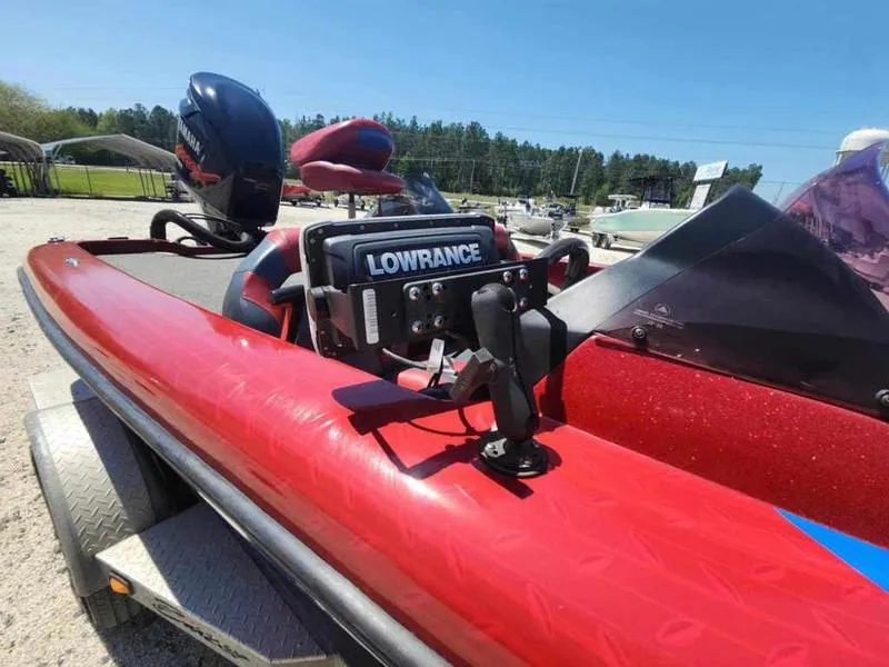 Slide: The Image of 2007 Blazer 190 Pro-V boat with Lowrance equipment, parked outdoors on a sunny day. - 7