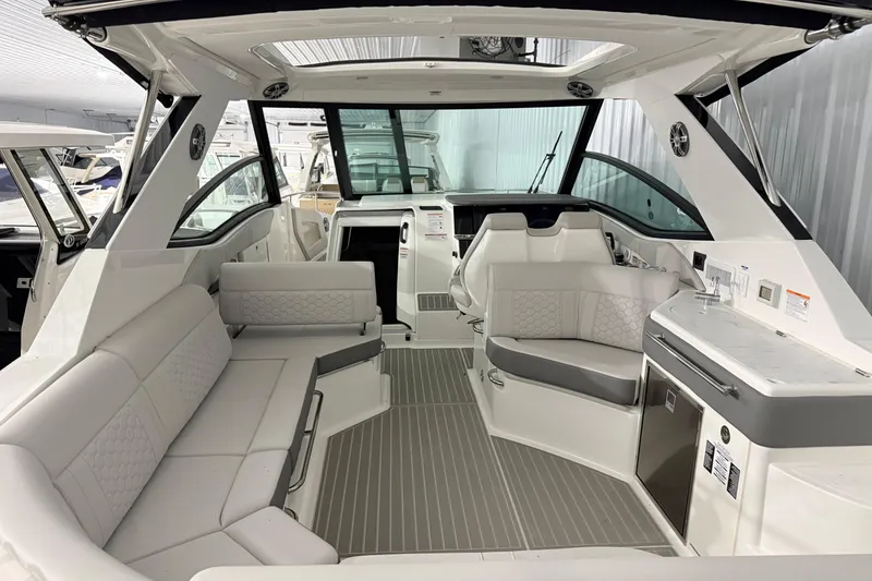 Slide: The Image of Luxurious interior of 2025 Sea Ray Sundancer 320 yacht with elegant seating and modern amenities. - 42
