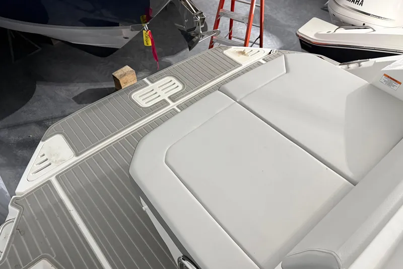 Slide: The Image of 2025 Sea Ray Sundancer 320 swim platform and seating area in a showroom. - 51