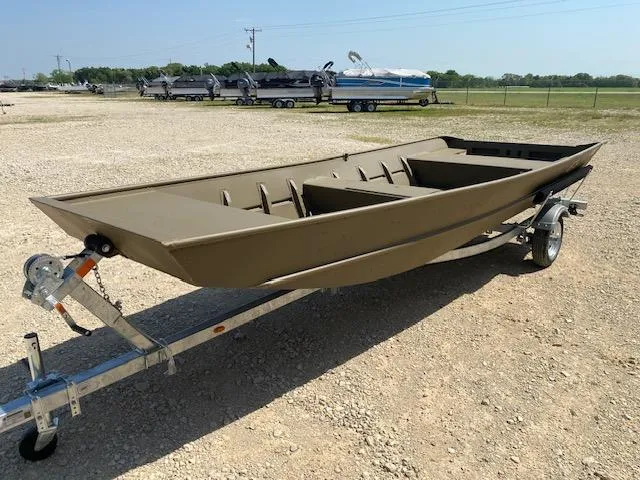 Slide: The Image of 2025 G3 Gator Tough 1648 LW boat on trailer, parked on gravel lot. - 3