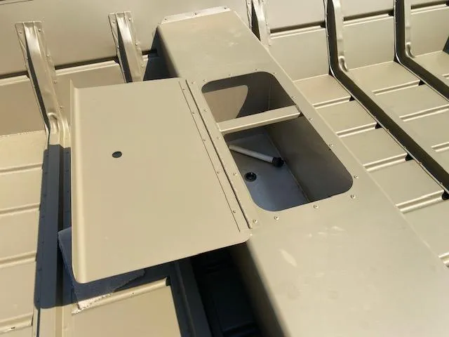 Slide: The Image of 2025 G3 Gator Tough 1648 LW boat interior with open storage compartment. - 5