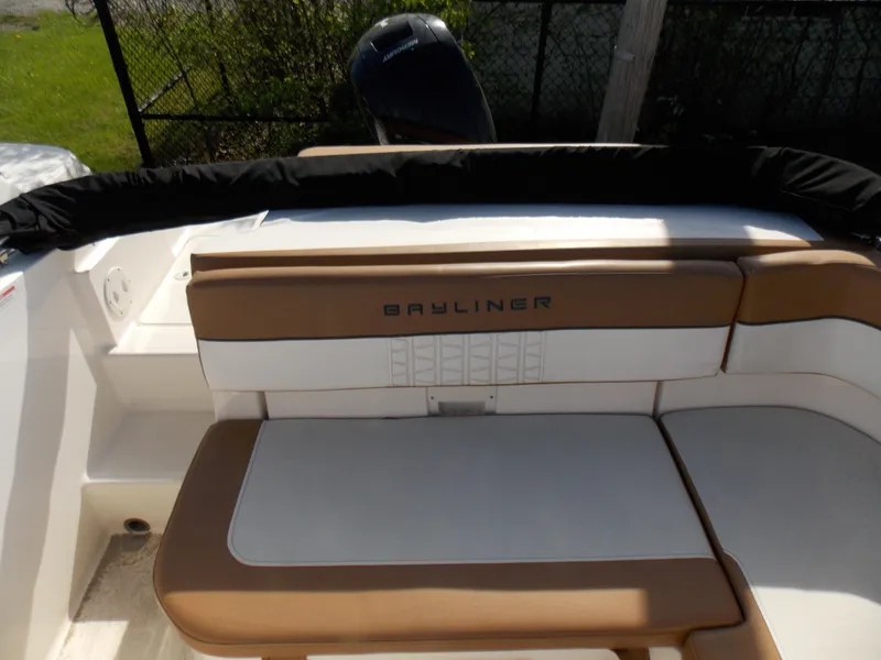Slide: The Image of 2021 Bayliner VR5 Bowrider OB boat interior with tan and white seating. - 14