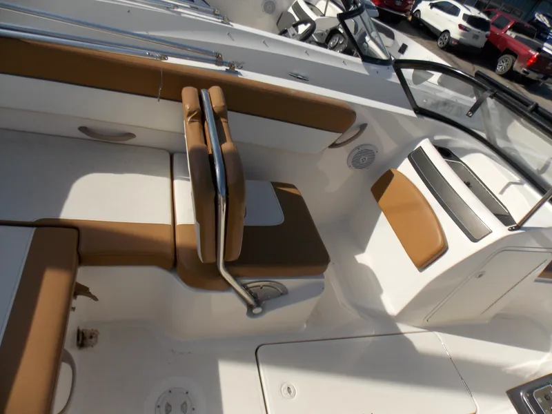 Slide: The Image of 2021 Bayliner VR5 Bowrider OB interior with tan seating and sleek design. - 15
