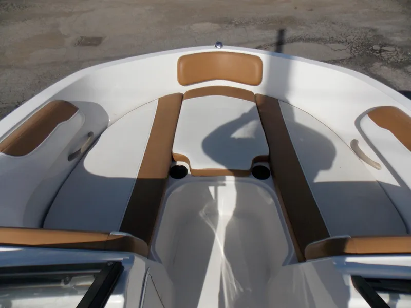 Slide: The Image of 2021 Bayliner VR5 Bowrider OB interior with tan and white seating. - 18