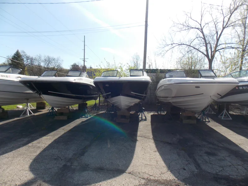 Slide: The Image of 2021 Bayliner VR5 Bowrider OB boats displayed outdoors in a row. - 21
