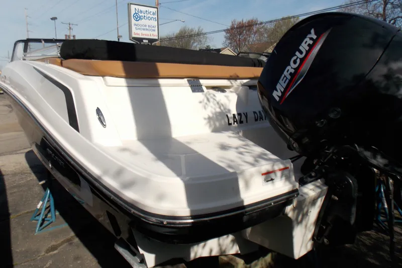 Slide: The Image of 2021 Bayliner VR5 Bowrider OB with Mercury outboard engine, docked outdoors. - 5