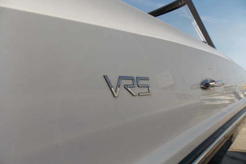 Slide: The Image of 2021 Bayliner VR5 Bowrider OB side view with logo detail. - 7