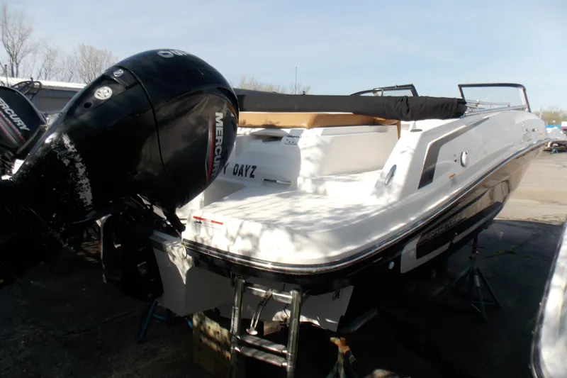 Slide: The Image of 2021 Bayliner VR5 Bowrider OB with Mercury outboard engine, parked outdoors. - 8
