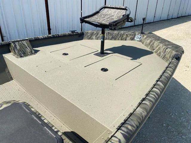 Slide: The Image of 2025 SeaArk Shadow 18 boat with elevated seat and storage compartments. - 10