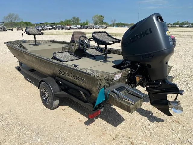 Slide: The Image of 2025 SeaArk Shadow 18 boat with Suzuki outboard motor on a trailer. - 4