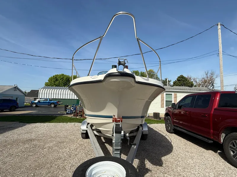 Slide: The Image of 1998 Bayliner 2052 Trophy Walkaround boat on trailer, parked outdoors. - 20