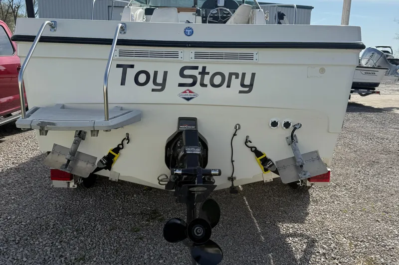 Slide: The Image of 1998 Bayliner 2052 Trophy Walkaround boat named "Toy Story" with dual propellers. - 4