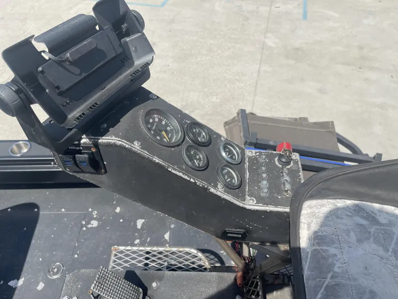 Slide: The Image of Control panel of a 2008 Custom Alumitech 20 Airboat with gauges and switches. - 6