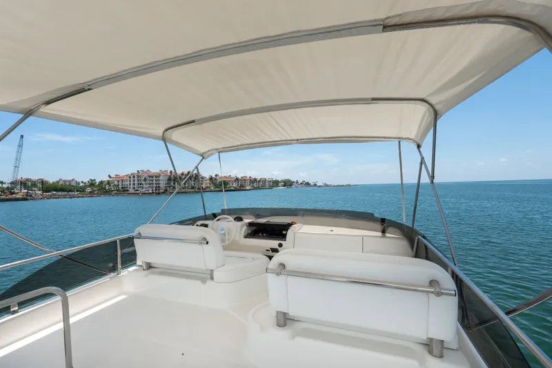 Slide: The Image of Flybridge view of 1998 Azimut 43 Fly yacht on calm waters. - 21