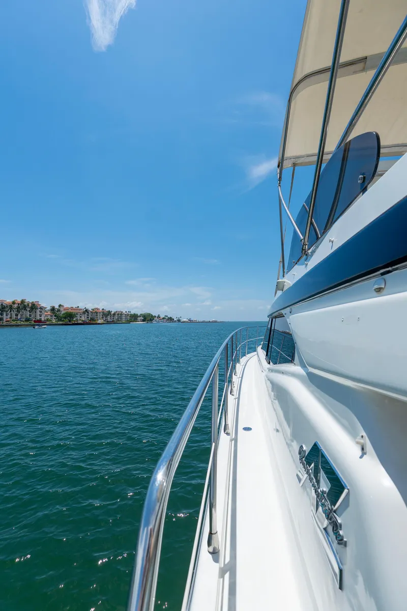Slide: The Image of Azimut 43 Fly yacht cruising on clear blue waters under a sunny sky. - 30