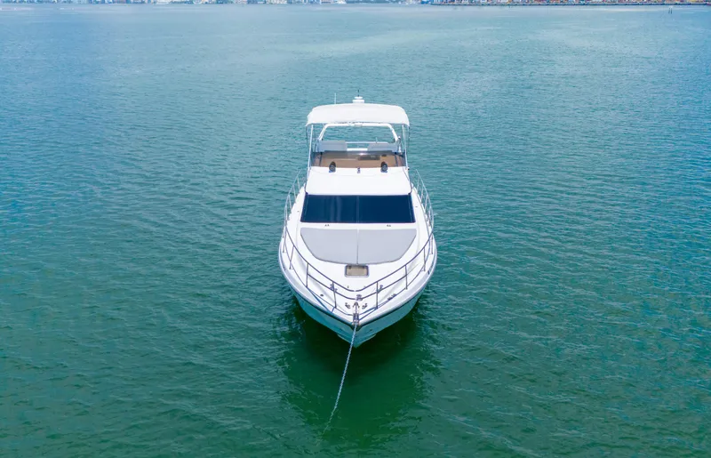 Slide: The Image of Azimut 43 Fly yacht from 1998 anchored on calm water, front view. - 6