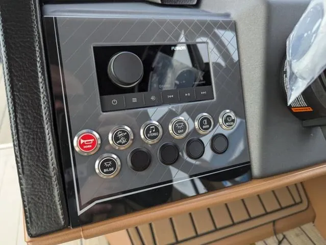 Slide: The Image of Control panel of 2025 Avalon Catalina Quad Lounger 23 FT with stereo and function buttons. - 14