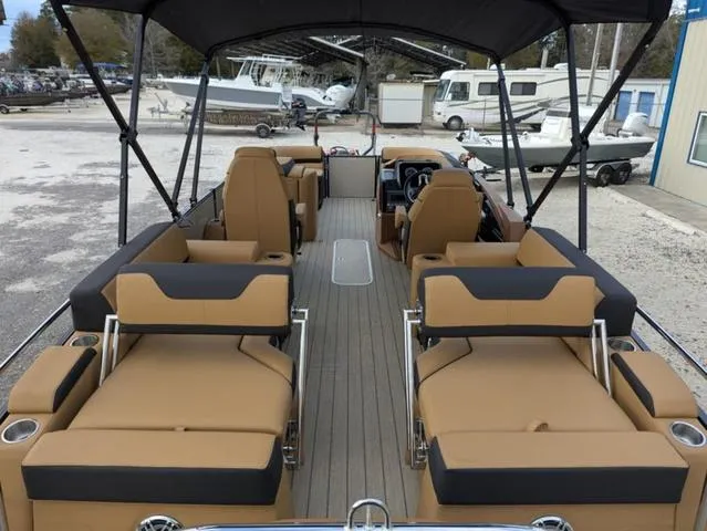 Slide: The Image of 2025 Avalon Catalina Quad Lounger 23 FT with spacious seating and canopy, docked at marina. - 26