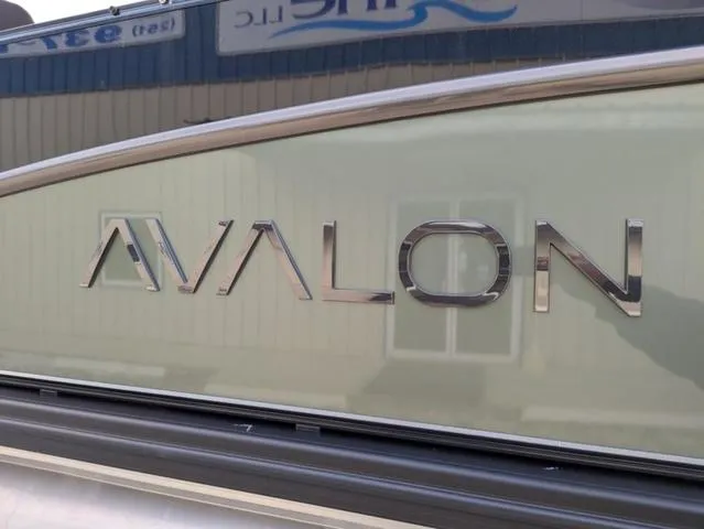 Slide: The Image of 2025 Avalon Catalina Quad Lounger 23 FT logo on boat exterior. - 3
