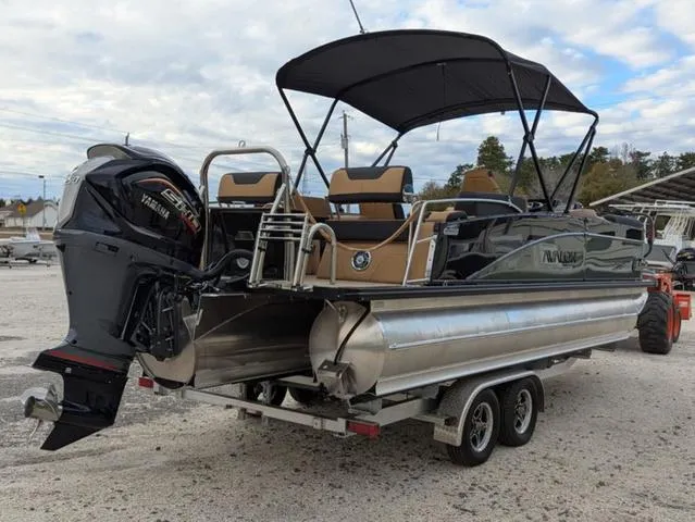 Slide: The Image of 2025 Avalon Catalina Quad Lounger 23 FT pontoon boat on trailer, featuring Yamaha outboard motor. - 6